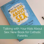 book on desk, white text against green background reads talking with your kids about sex: new book for catholic parents
