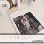 book rests on a desk. title reads "charting for girls handbook"